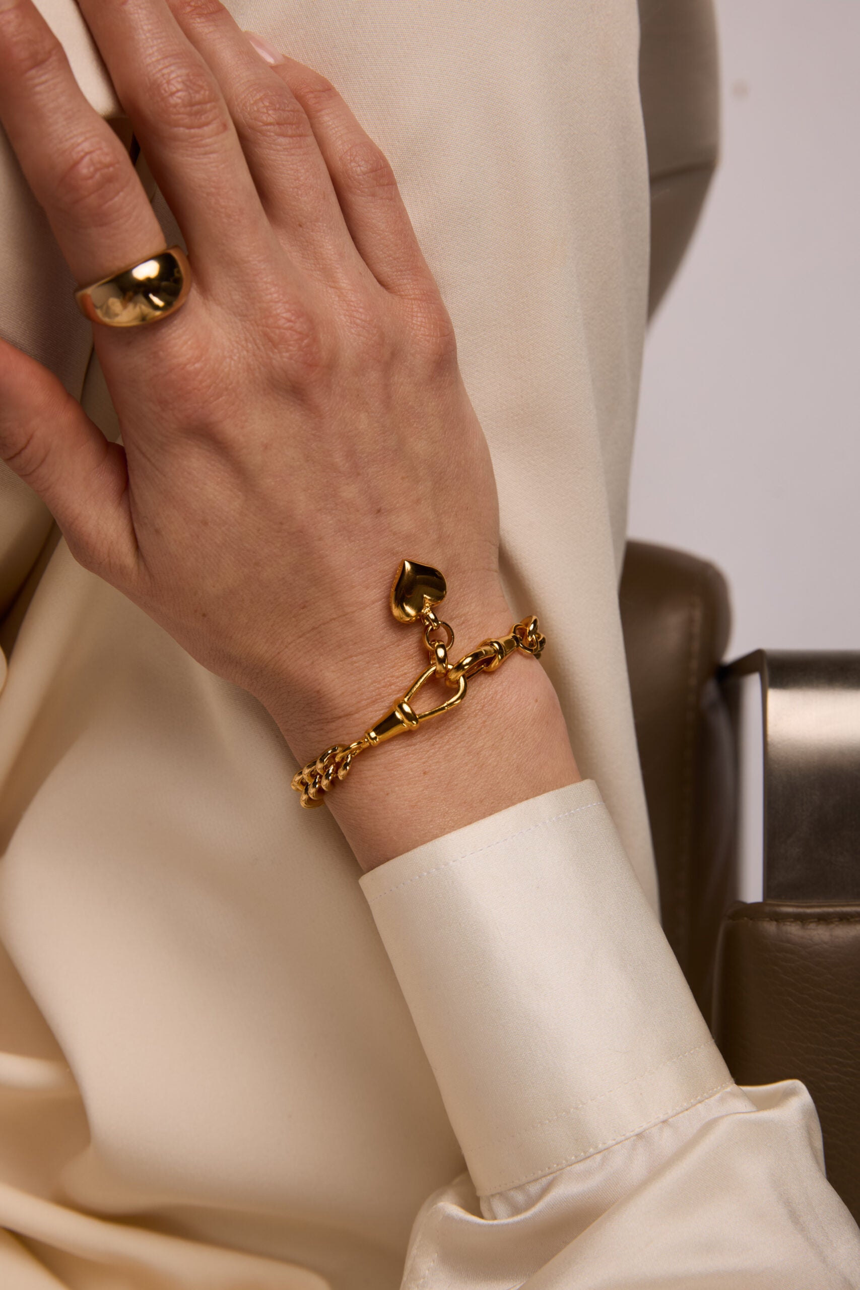 Small Gold Heart on Medium Curb Clipt Bracelet