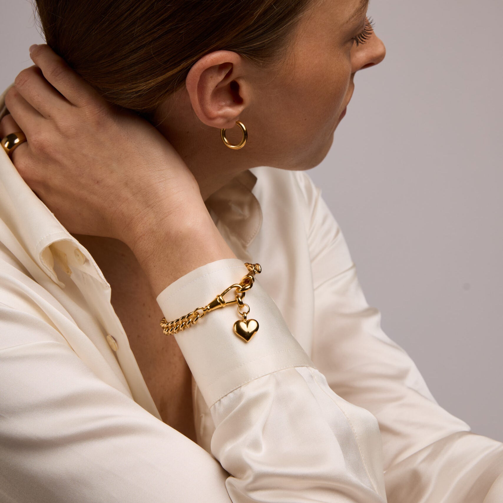 Small Gold Heart on Medium Curb Clipt Bracelet