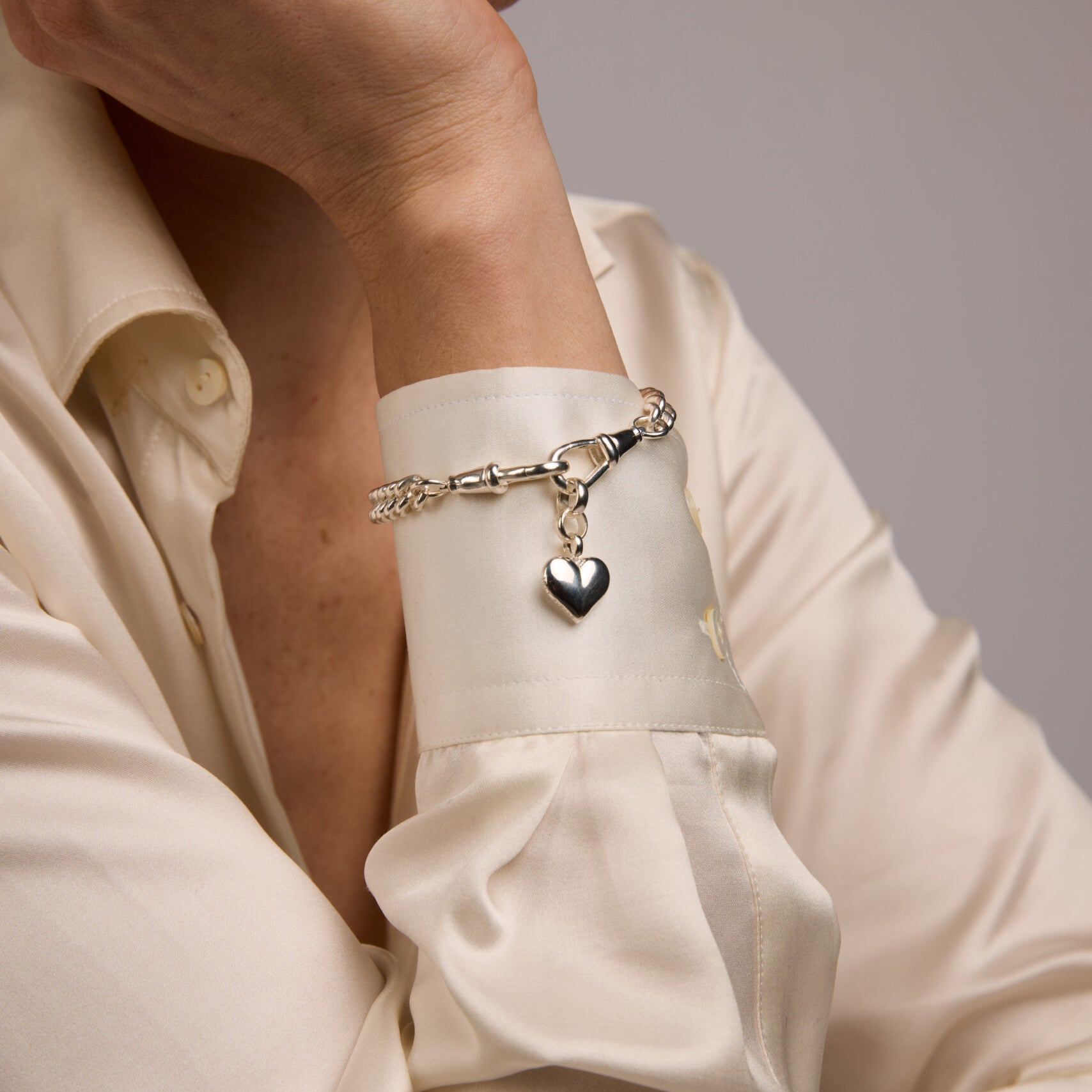 Small Silver Heart on Medium Curb Clipt Bracelet