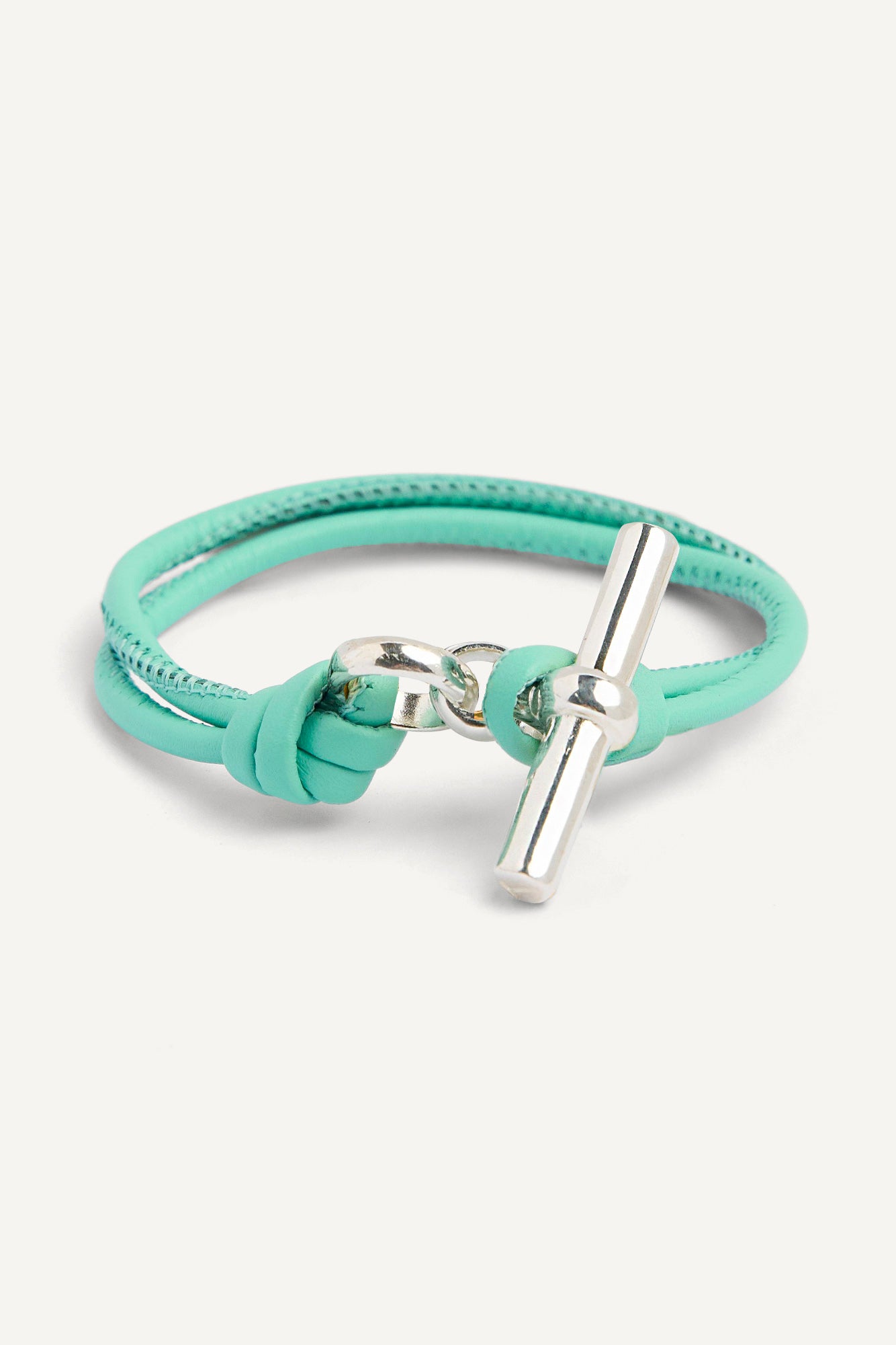 Light teal leather bracelet with silver T-bar and clasp detail