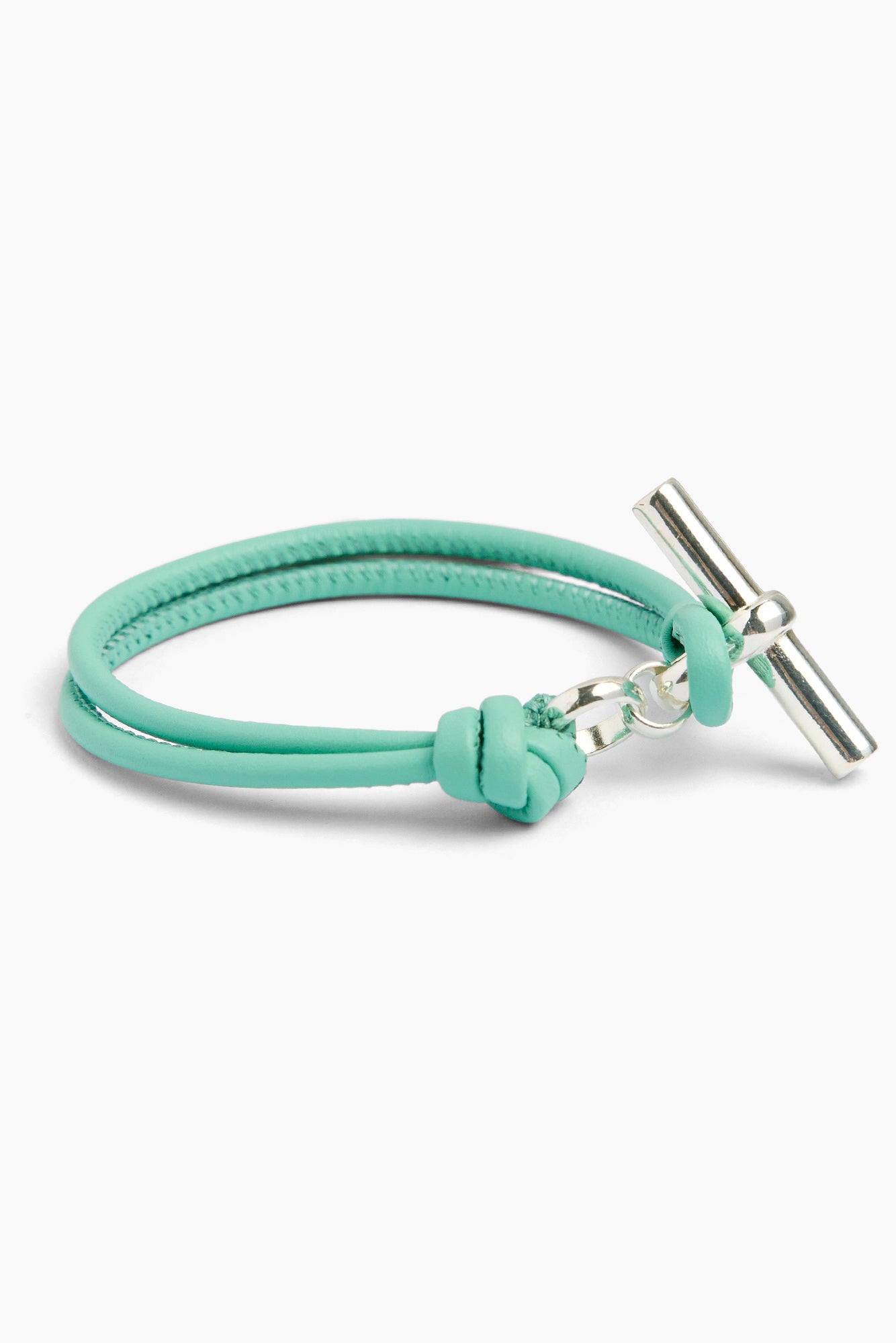 Light teal leather bracelet with silver T-bar charm and knot clasp
