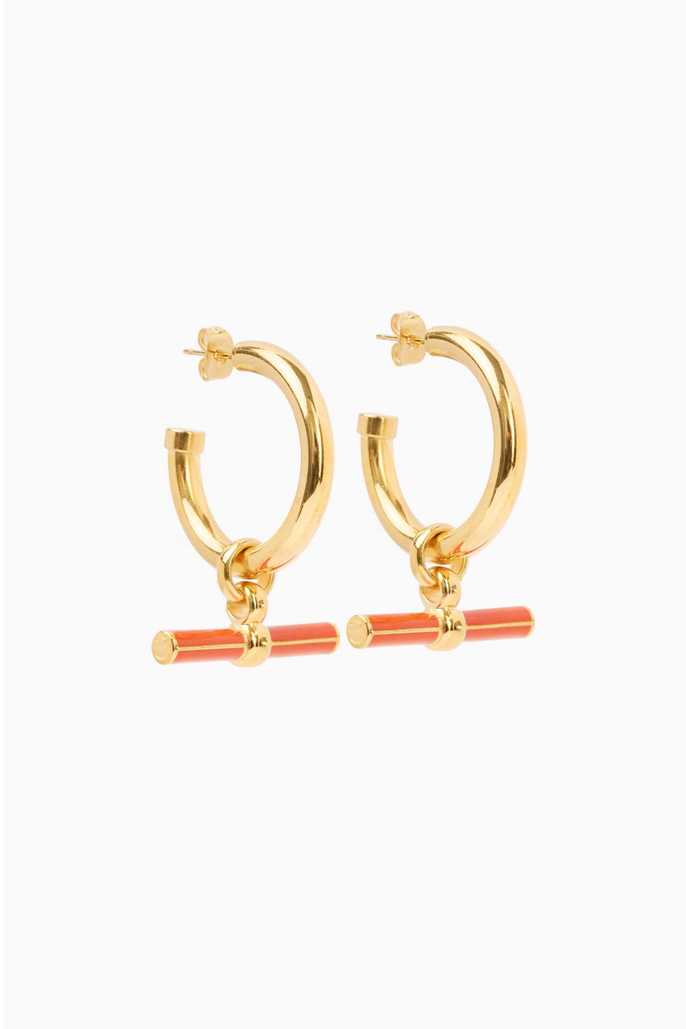 Gold hoop earrings with hinged charm and orange enamel crossbar