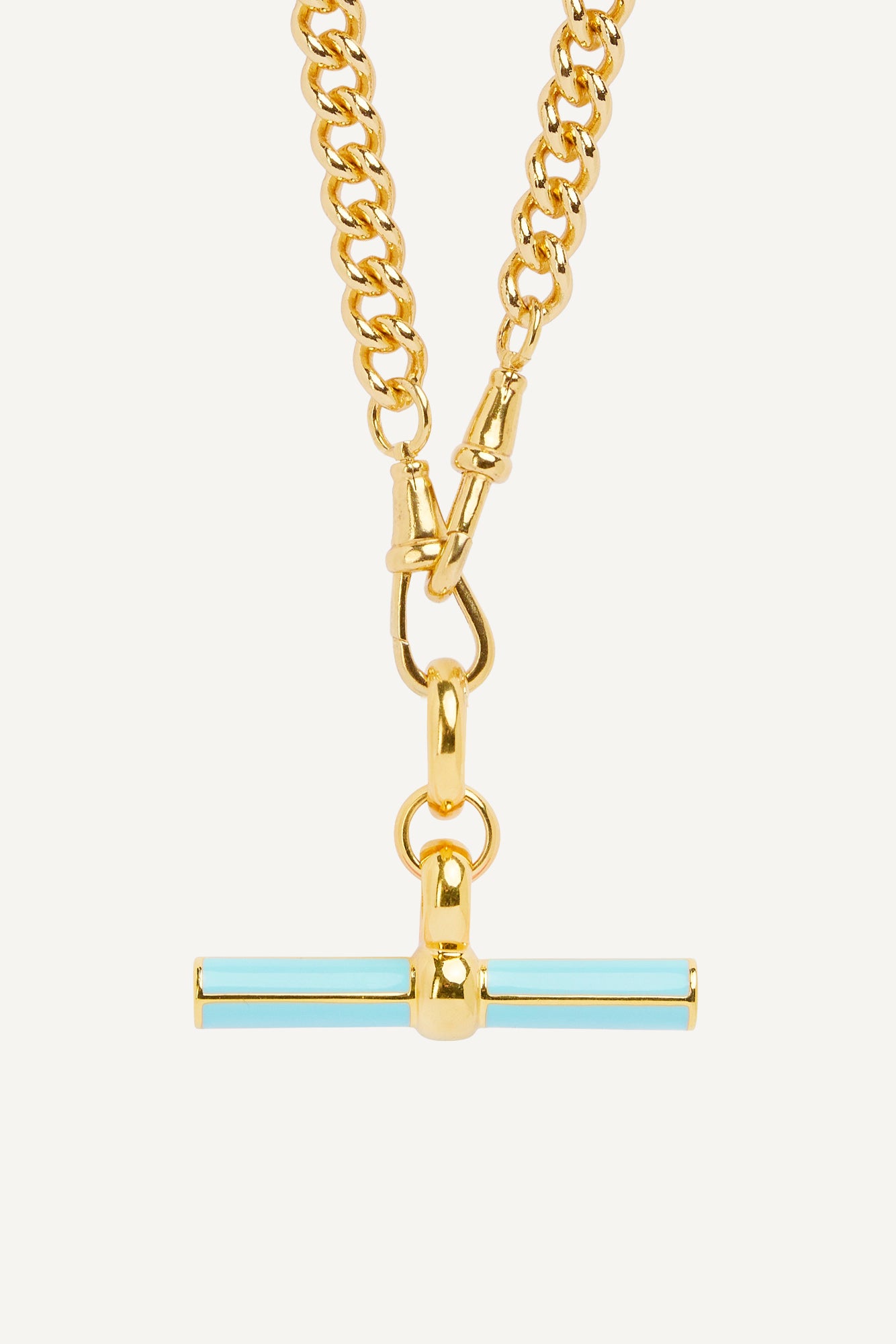 Gold curb-link chain necklace with blue enamel T-bar pendant