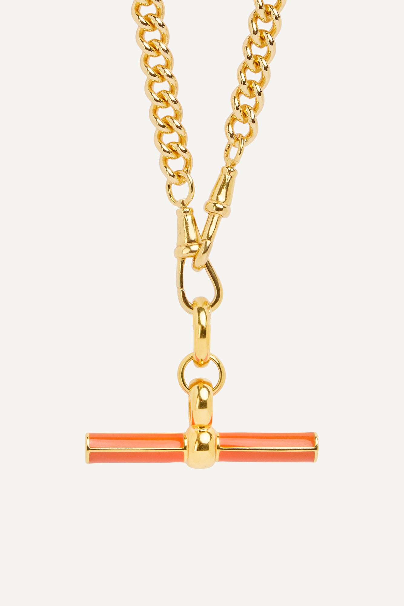 Gold curb-link chain necklace with orange enamel T-bar pendant