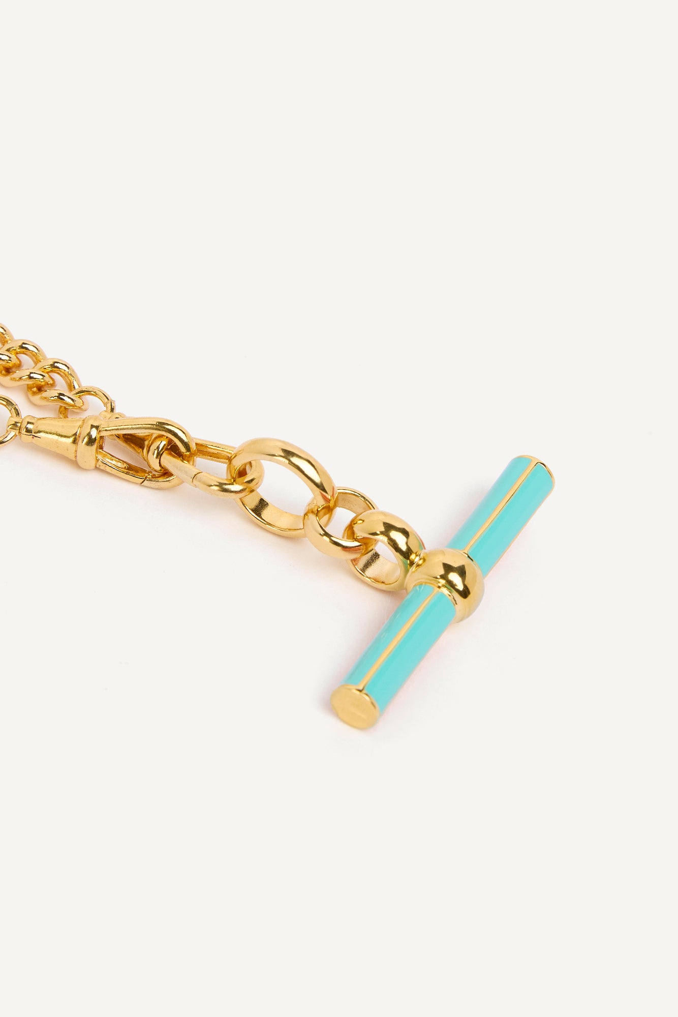 Gold curb chain necklace with mint enamel T-bar pendant detail