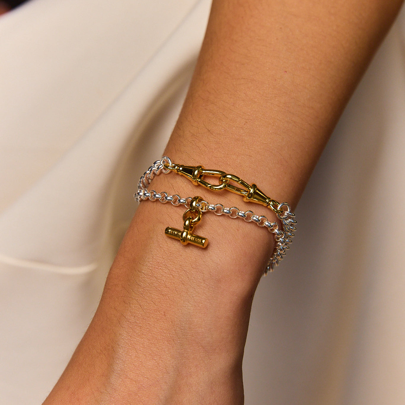 Silver chain bracelet with gold T-bar charm and linked sections