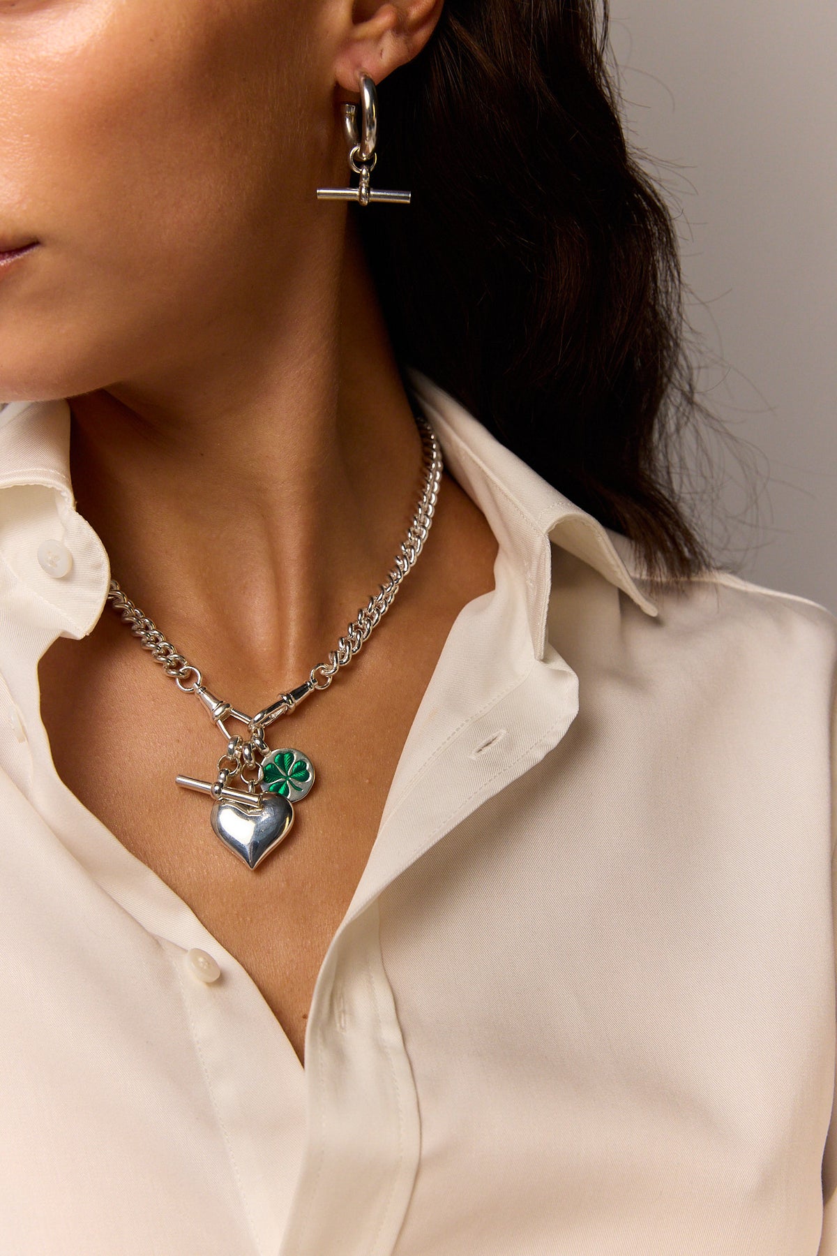 Heart charm necklace with silver chain and green clover heart pendant