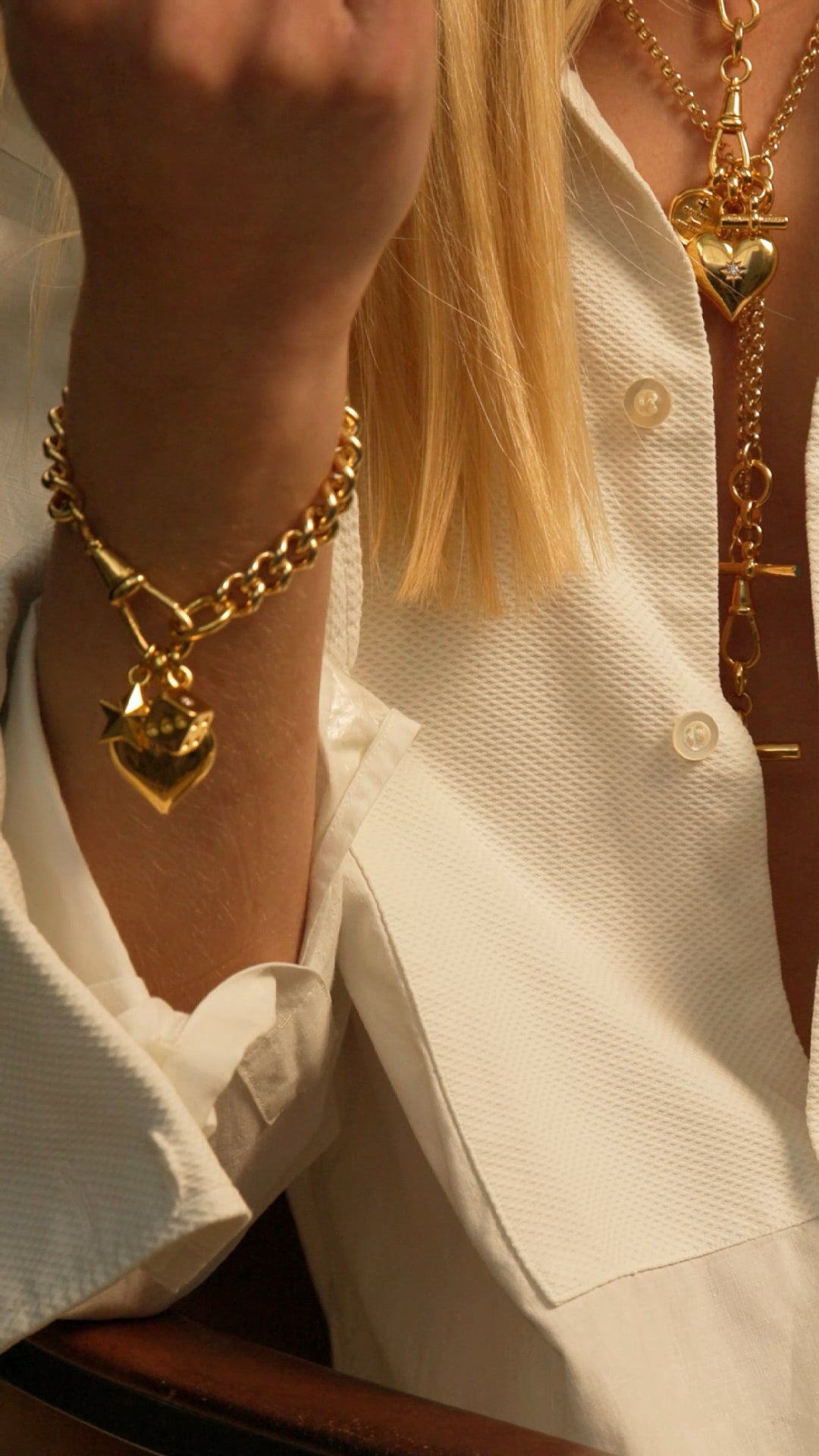 Gold chain charm bracelet set with heart charm and small pendant charm